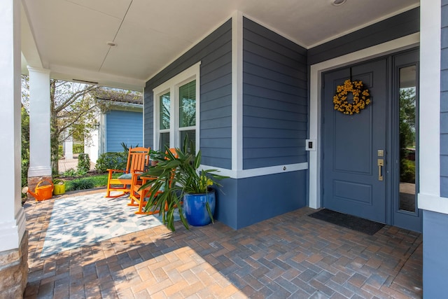 doorway to property with a porch