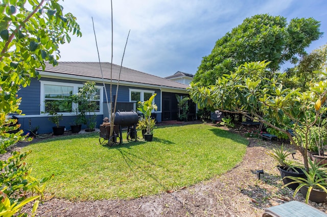 back of house featuring a lawn