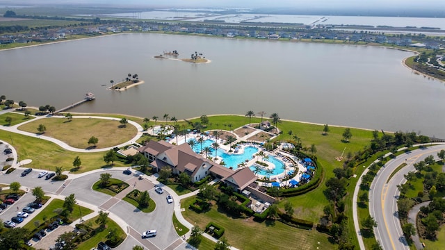 birds eye view of property with a water view