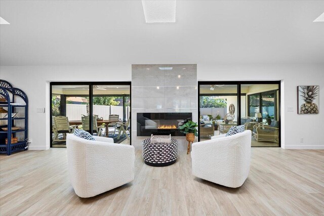 dining room with a wealth of natural light, visible vents, indoor wet bar, and light wood-style floors