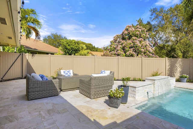 view of patio featuring an outdoor living space and a fenced backyard