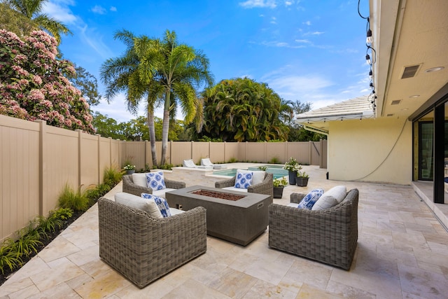 view of patio featuring an outdoor living space with a fire pit, a fenced backyard, and a fenced in pool