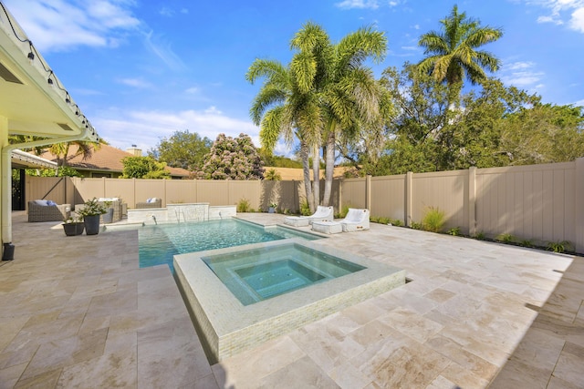 view of pool featuring a patio, a fenced in pool, an in ground hot tub, a fenced backyard, and outdoor lounge area