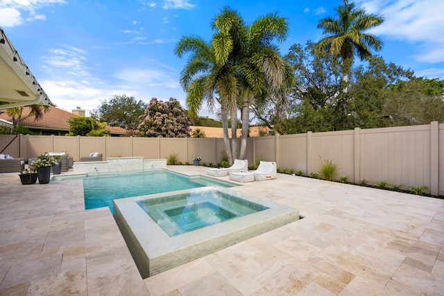 view of swimming pool with an in ground hot tub, a fenced backyard, and a patio area