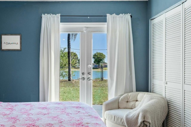 bedroom featuring french doors and access to outside