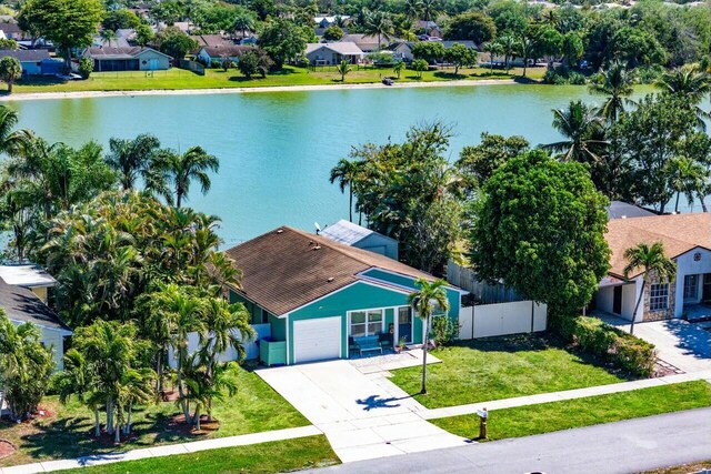 bird's eye view featuring a residential view and a water view