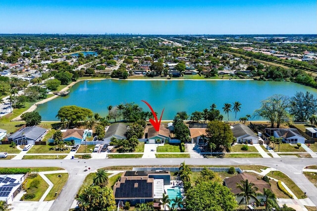 bird's eye view with a residential view and a water view