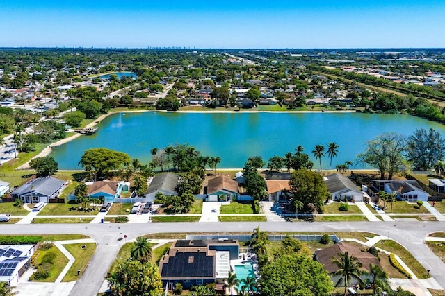 birds eye view of property featuring a residential view and a water view