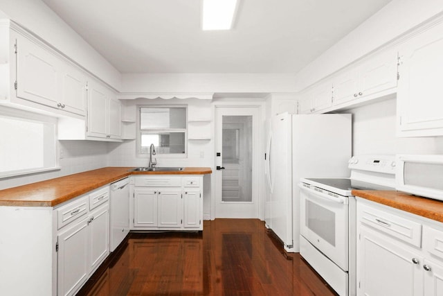 kitchen with white appliances, white cabinets, dark wood finished floors, open shelves, and a sink