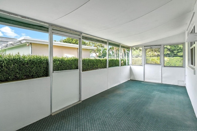 unfurnished sunroom with vaulted ceiling