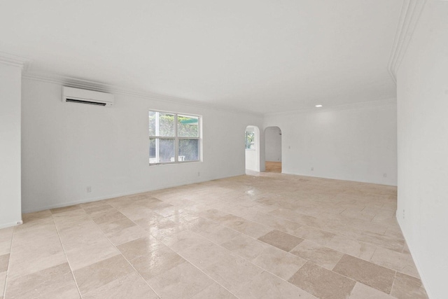 empty room featuring ornamental molding, arched walkways, and a wall unit AC