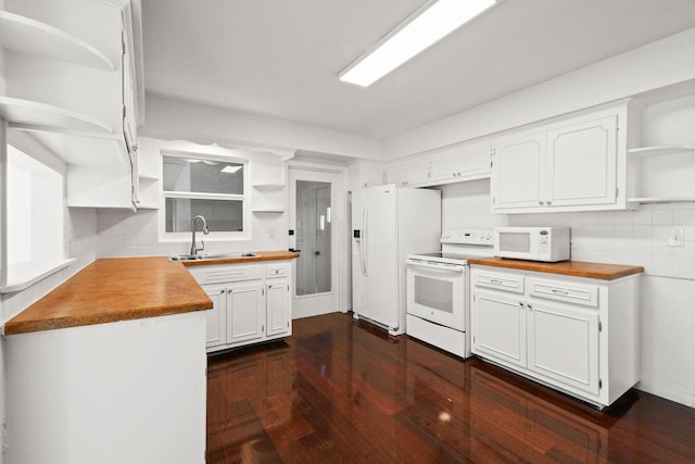 kitchen with open shelves, dark wood-type flooring, white cabinets, a sink, and white appliances