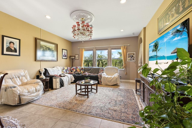 tiled living area with baseboards, a notable chandelier, and recessed lighting