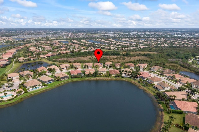 drone / aerial view with a residential view and a water view