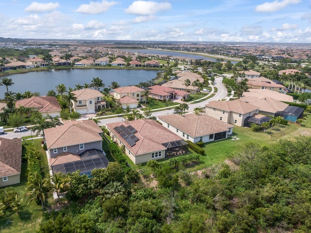 aerial view with a residential view and a water view