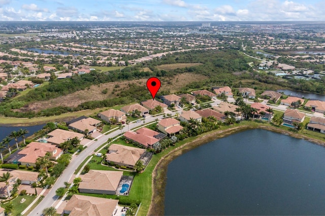 bird's eye view featuring a residential view and a water view