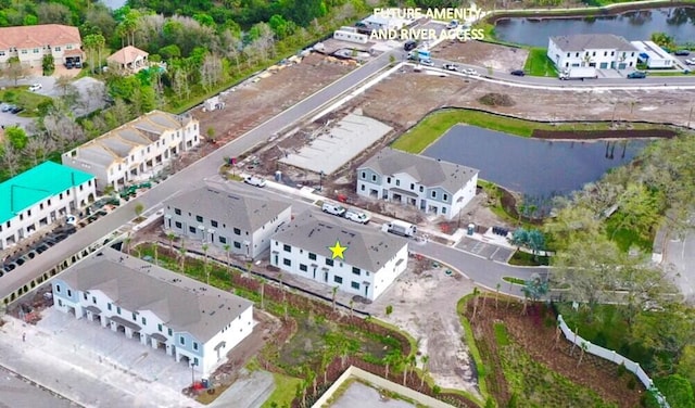 aerial view featuring a residential view and a water view