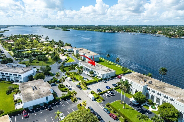 birds eye view of property with a water view