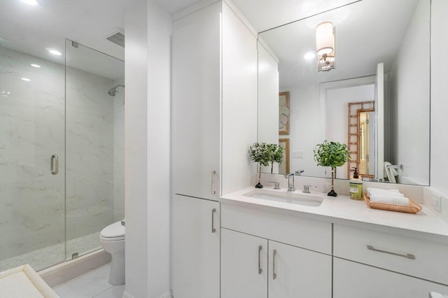 full bath featuring a marble finish shower, visible vents, toilet, marble finish floor, and vanity