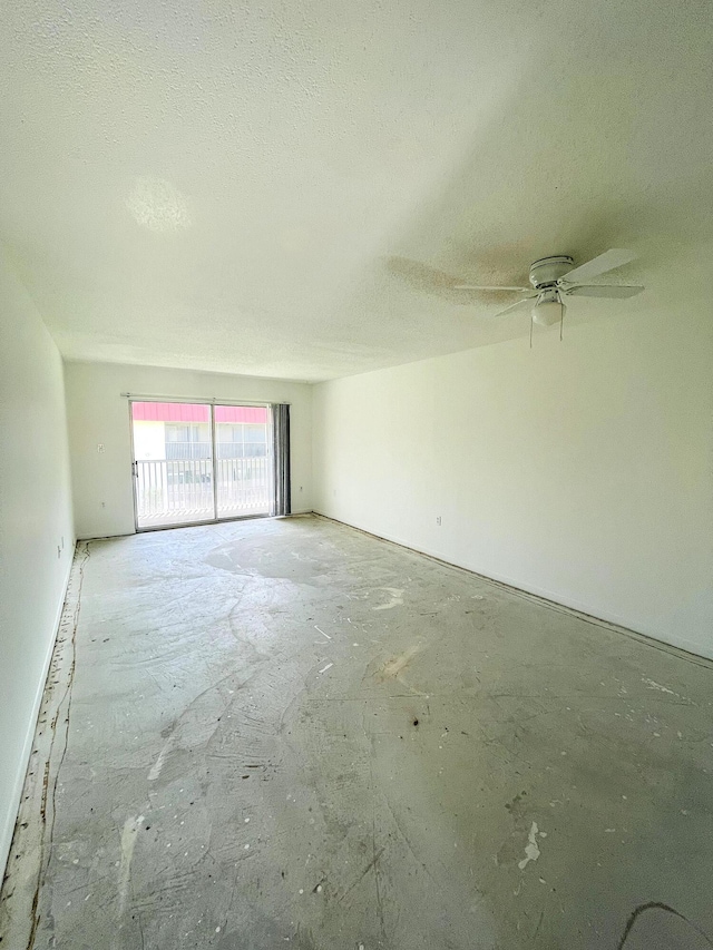 empty room with a textured ceiling