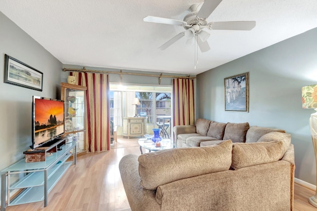 1 Abbey Ln Unit 201, Delray Beach, FL 33446 - living area featuring light wood-style flooring, a ceiling fan, and baseboards
