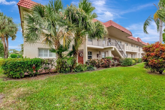 view of property featuring stairs