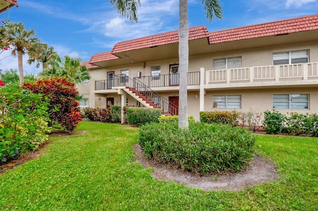 1 Abbey Ln Unit 201, Delray Beach, FL 33446 - view of building exterior featuring stairs