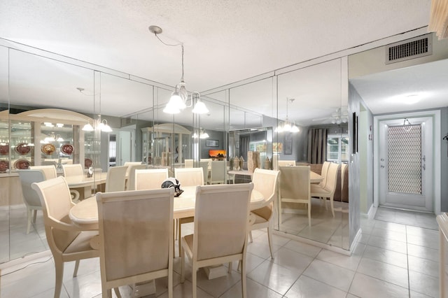 1 Abbey Ln Unit 201, Delray Beach, FL 33446 - dining room with light tile patterned floors, a chandelier, and ceiling fan