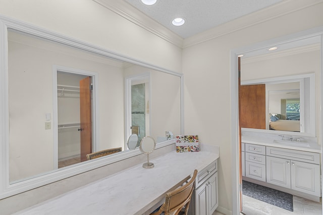 bathroom with vanity, a textured ceiling, recessed lighting, and ornamental molding