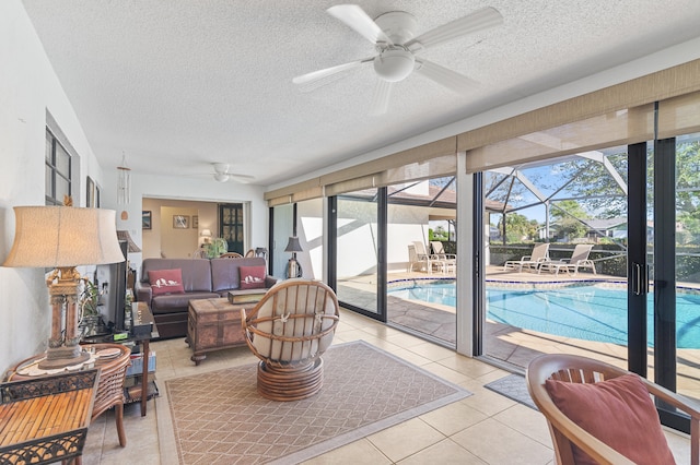 sunroom / solarium with a ceiling fan