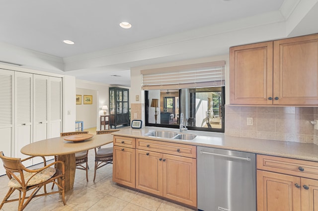 kitchen featuring stainless steel dishwasher, crown molding, backsplash, and a sink