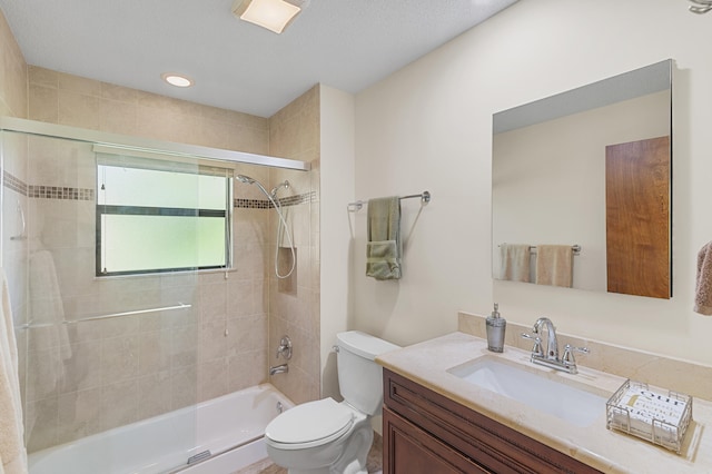 bathroom with toilet, vanity, and bathtub / shower combination