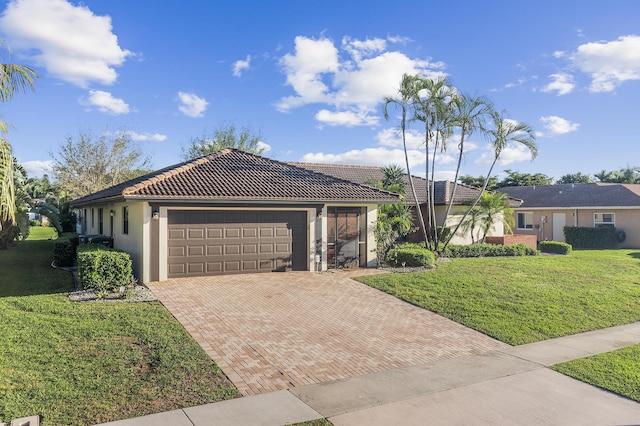 ranch-style home featuring an attached garage, stucco siding, a front lawn, a tile roof, and decorative driveway