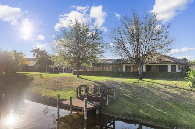 dock area with glass enclosure and a yard