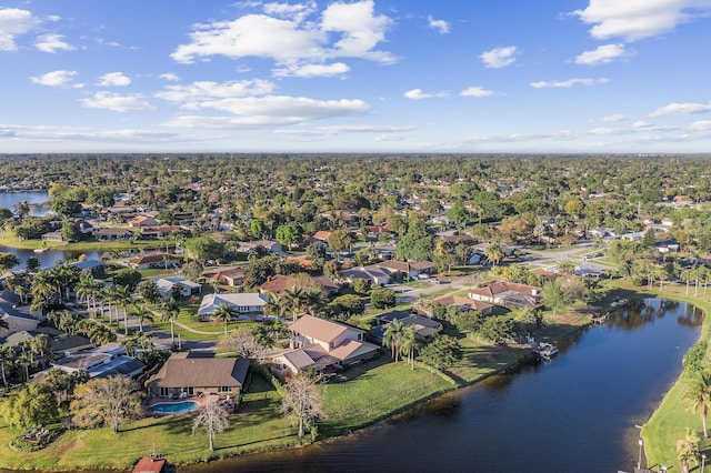 birds eye view of property with a water view and a residential view