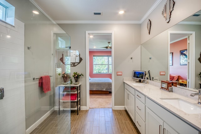 bathroom featuring ensuite bathroom, ornamental molding, a sink, and visible vents