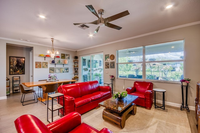 living area with ceiling fan with notable chandelier, baseboards, visible vents, and crown molding