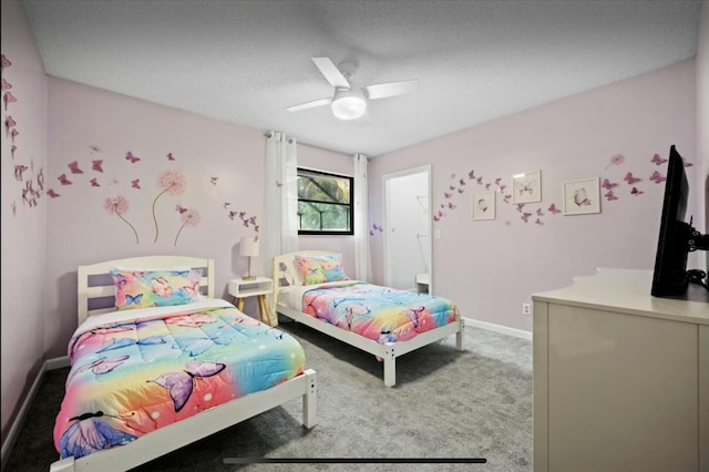 carpeted bedroom featuring ceiling fan and baseboards