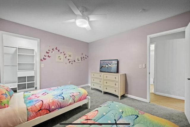 bedroom with carpet flooring, ceiling fan, and baseboards