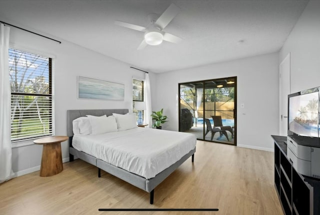 bedroom with baseboards, access to outside, a ceiling fan, and light wood-style floors