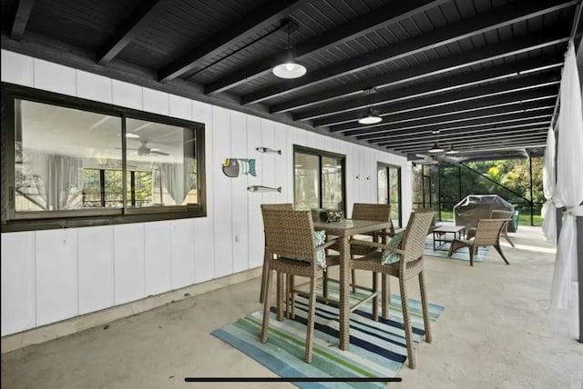 view of patio / terrace with a lanai and outdoor dining area