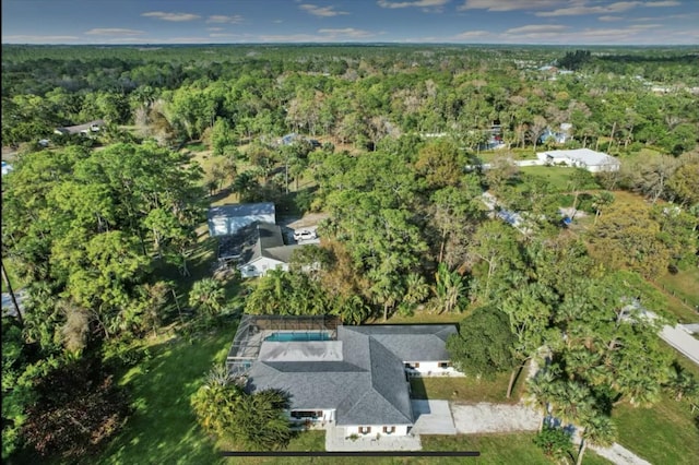 aerial view featuring a wooded view