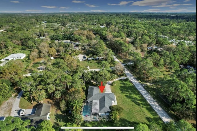 bird's eye view featuring a view of trees