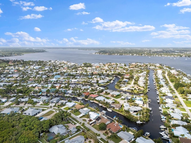 birds eye view of property featuring a residential view and a water view