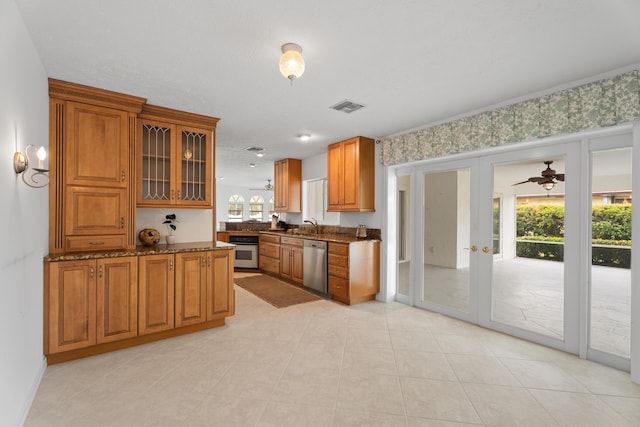 kitchen featuring visible vents, brown cabinets, appliances with stainless steel finishes, and french doors