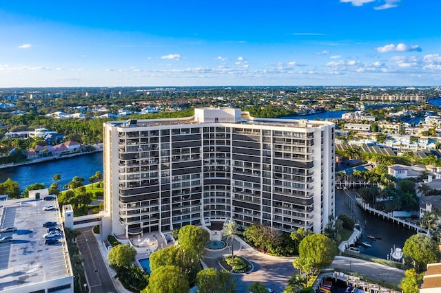 view of building exterior with a water view and a city view