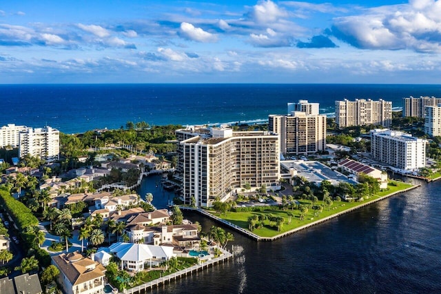 birds eye view of property featuring a water view and a city view