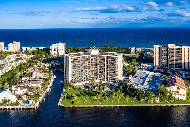 drone / aerial view featuring a water view and a city view