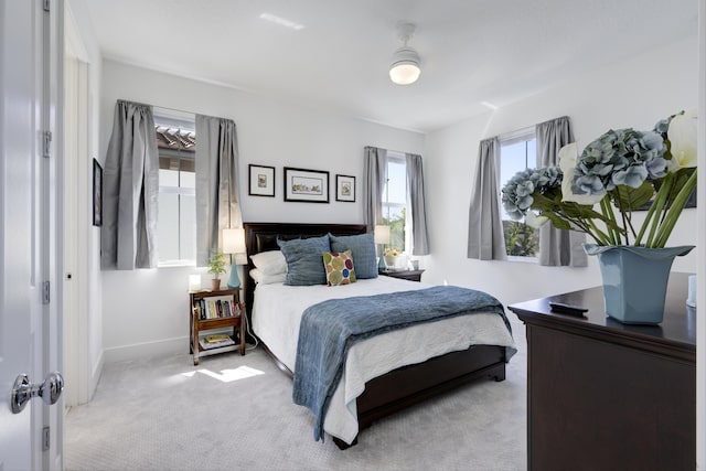 carpeted bedroom featuring baseboards