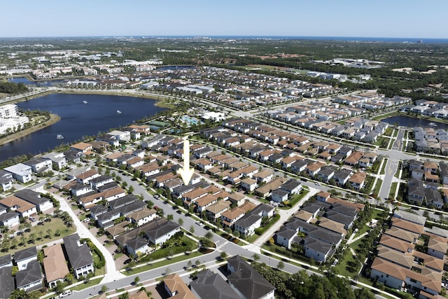 bird's eye view with a water view and a residential view